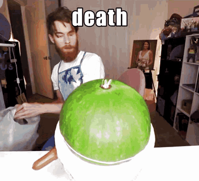 a man with a beard is cutting a green watermelon with the word death written on it