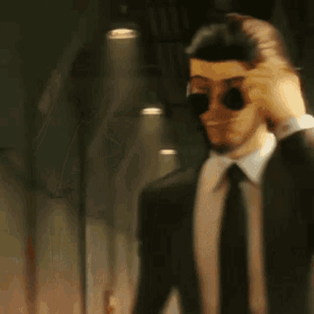 a man with a beard is wearing a hat and a suit