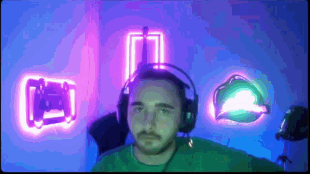 a man wearing headphones stands in front of a neon sign that says ' netflix '
