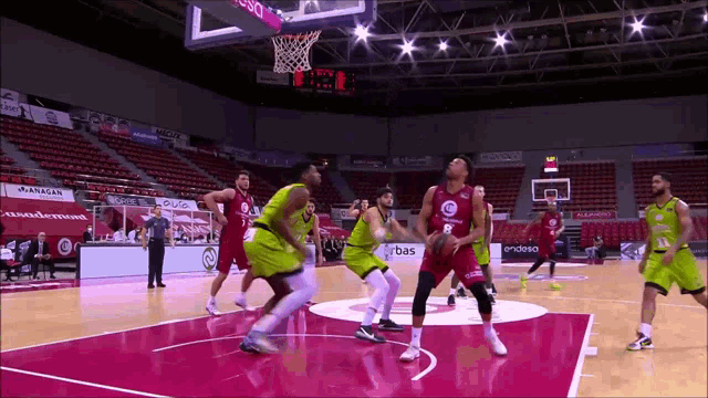 a basketball game is being played in a stadium with a sign that says endesa