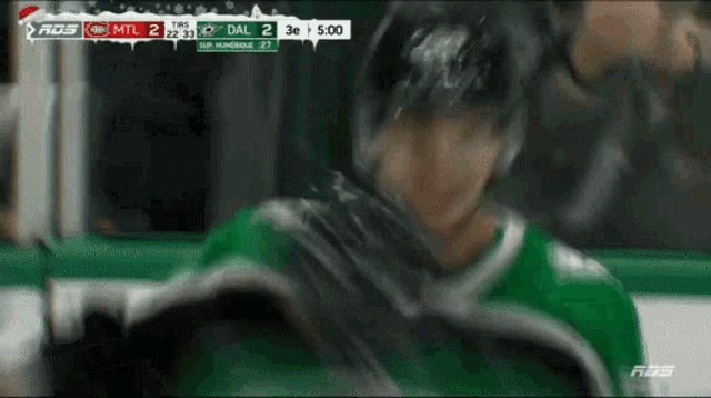 a hockey game is being played and the score is 2 to 3