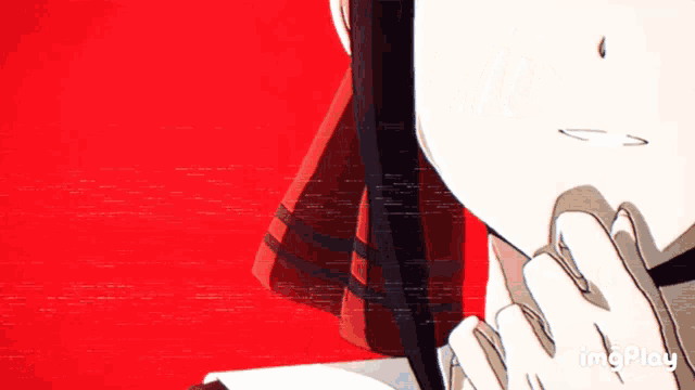 a close up of a person 's face with a red background and the word imgplay below it