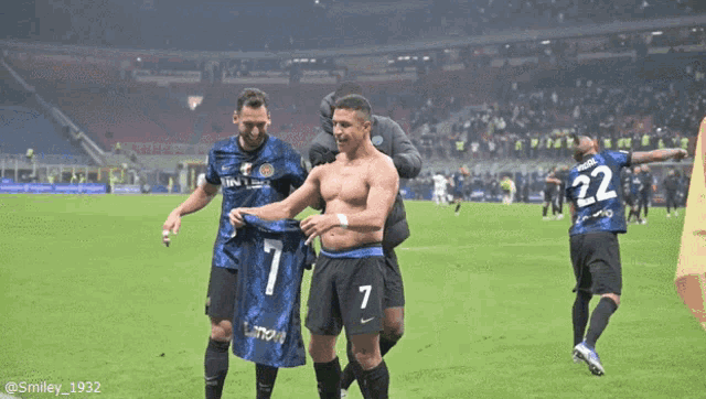 a shirtless soccer player with the number 1 on his shirt