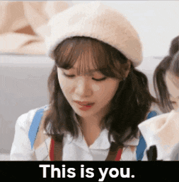 a woman wearing a beret and a white shirt says " this is you "