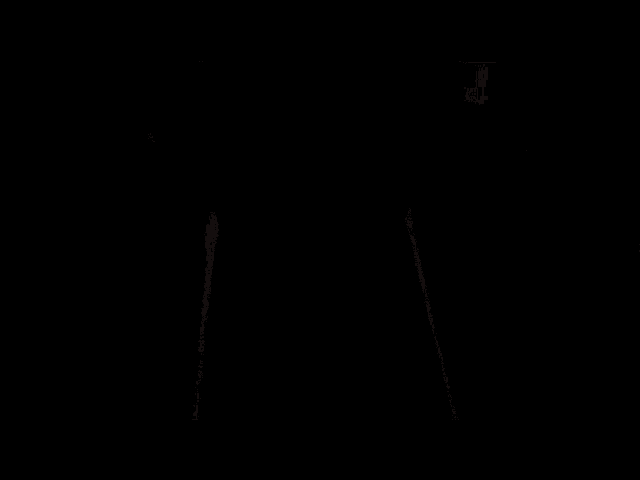 a woman in a bra is standing in front of a door with the word kapwing on the bottom of the screen .