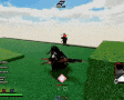 a blurry picture of a video game with a person laying on the grass .