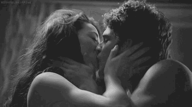 a black and white photo of a man and woman kissing with the caption wishfulshipping