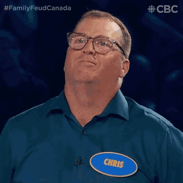 a man wearing glasses and a name tag that says chris on it