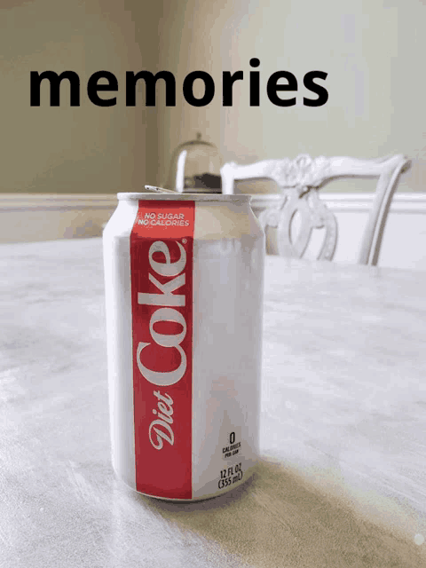 a can of diet coke sits on a table with the words memories above it