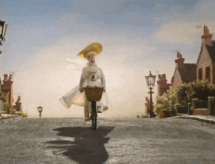 a cartoon character is riding a bike down a street