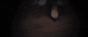 a close up of a person 's face with blood dripping from it 's mouth