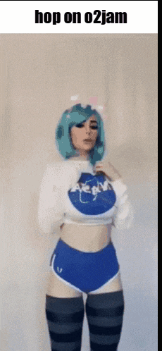 a girl with blue hair is wearing a nasa shirt