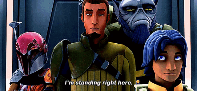 a group of cartoon characters are standing next to each other and one of them says i 'm standing right here