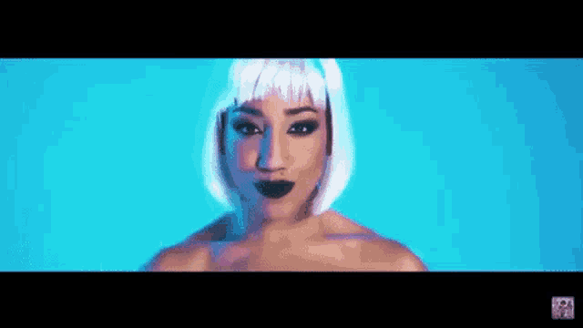 a woman covering her face with her hands in a blue background
