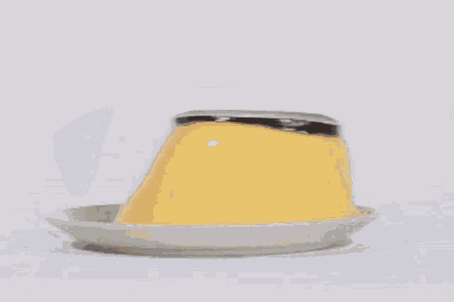 a close up of a pudding cup on a plate .