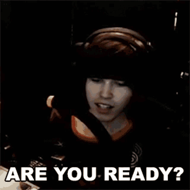 a man wearing headphones is asking are you ready .