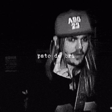 a man wearing a hat that says abc 23 on it