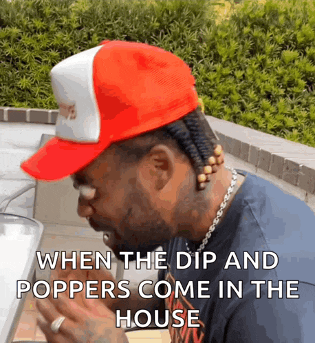 a man wearing a red and white hat with a caption that says when the dip and poppers come in the house
