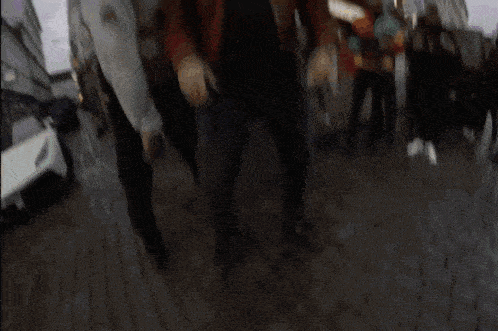a man in a red jacket with a dollar sign on his chest