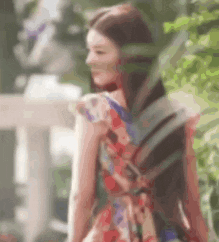 a blurry picture of a woman wearing a dress