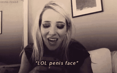 a woman is laughing while holding a cell phone and says " lol penis face "