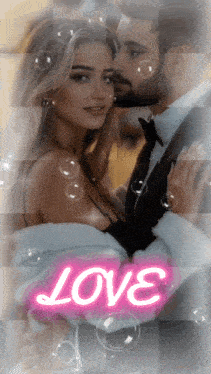 a picture of a man kissing a woman with the word love written on it