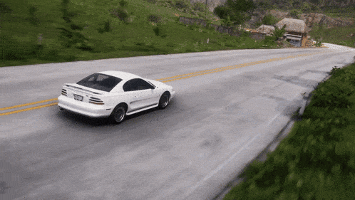 a white car is driving down a road with a license plate that says ' nc ' on it