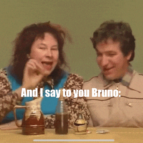 a man and a woman are sitting at a table with the words " and i say to you bruno "