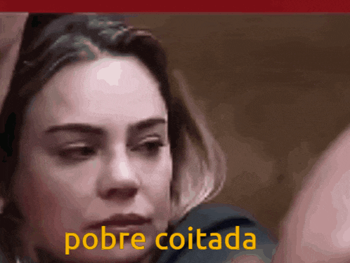 a close up of a woman 's face with the words pobre coitada written in yellow