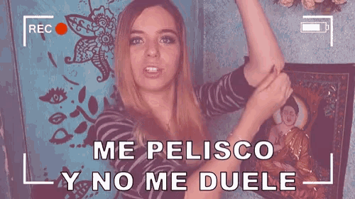 a woman 's arm is being recorded with the words me pelisco y no me duele