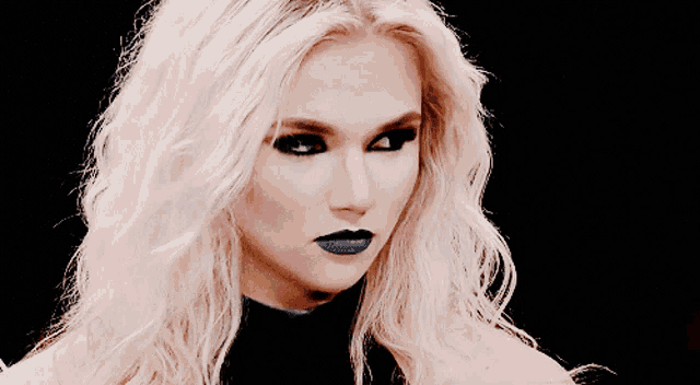 a close up of a woman with blonde hair and blue lipstick