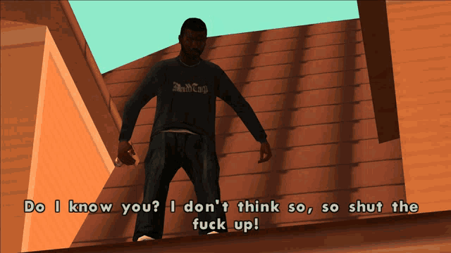 a man in a black shirt that says ' black cap ' on it stands on a roof