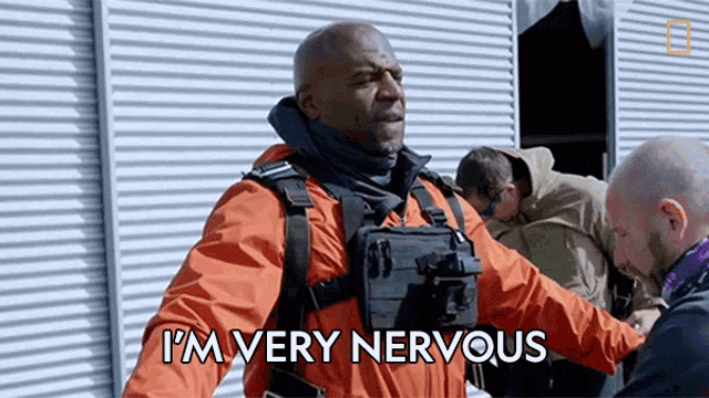 a man in an orange jacket says i 'm very nervous .