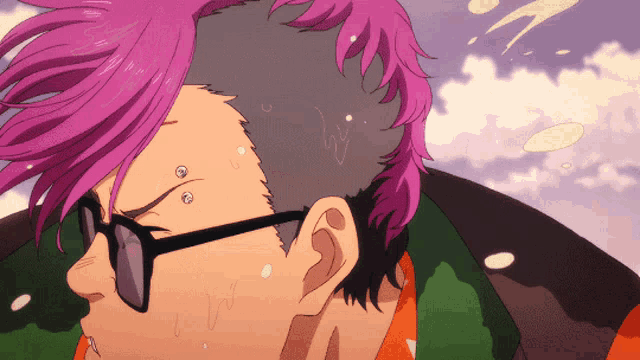 a man with pink hair is wearing sunglasses and a green shirt