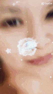 a close up of a person 's face with a flower on it