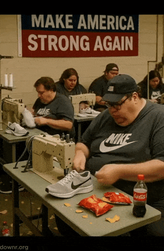 a sign that says make america strong again hangs above a factory