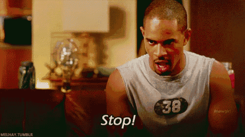 a man wearing a shirt with the number 38 on it is saying " stop "