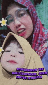 a woman wearing glasses and a hijab stands next to a little girl who is wearing a yellow hijab