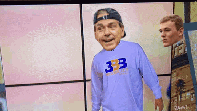 a man wearing a 333 shirt stands in front of another man