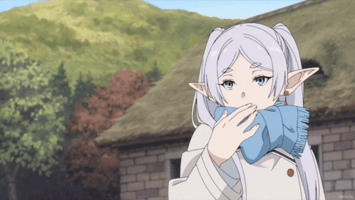 a girl with white hair and blue eyes is wearing a blue scarf
