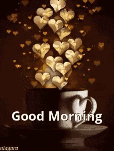 a cup of coffee with gold hearts coming out of it and the words good morning