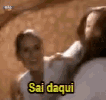 a woman is carrying a child on her back and the child is saying sai daqui .