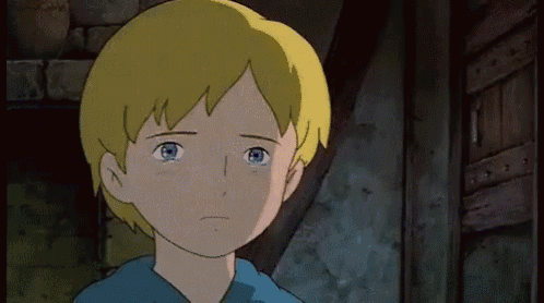 a boy with blonde hair and blue eyes is looking at the camera with a sad look on his face