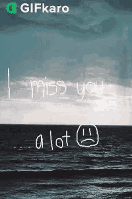 a picture of the ocean with the words " i miss you a lot "