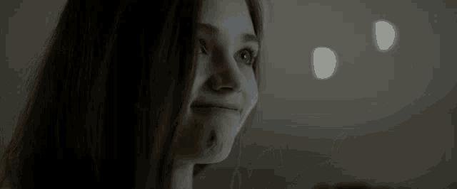 a close up of a woman eating a piece of bread