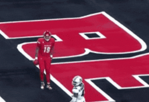 a football player in a red uniform with the number 19 on his jersey