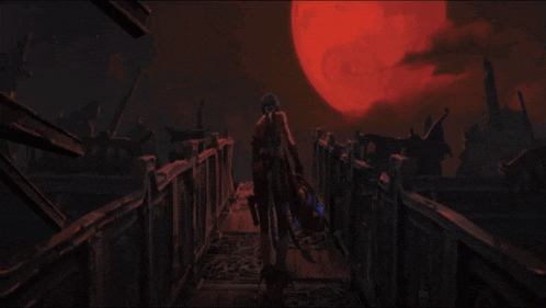 a person is standing on a bridge in front of a red moon