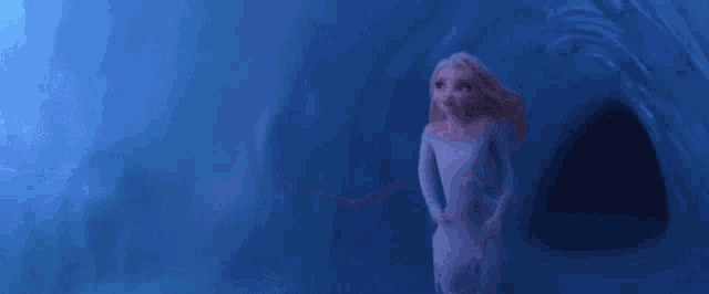 elsa is standing in the middle of an ice cave in frozen 2 .