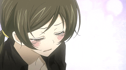 a close up of a girl 's face with tears running down her cheeks