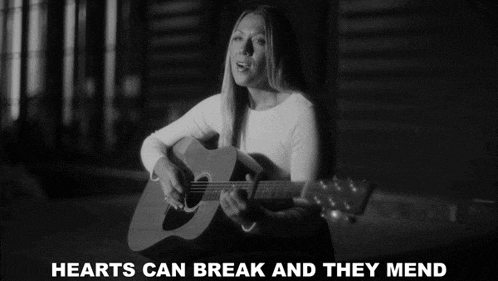 a black and white photo of a woman playing a guitar with the words " hearts can break and they mend " below her